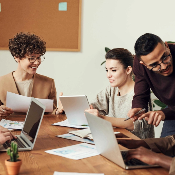 Business professionals discussing salary threshold changes in the Netherlands