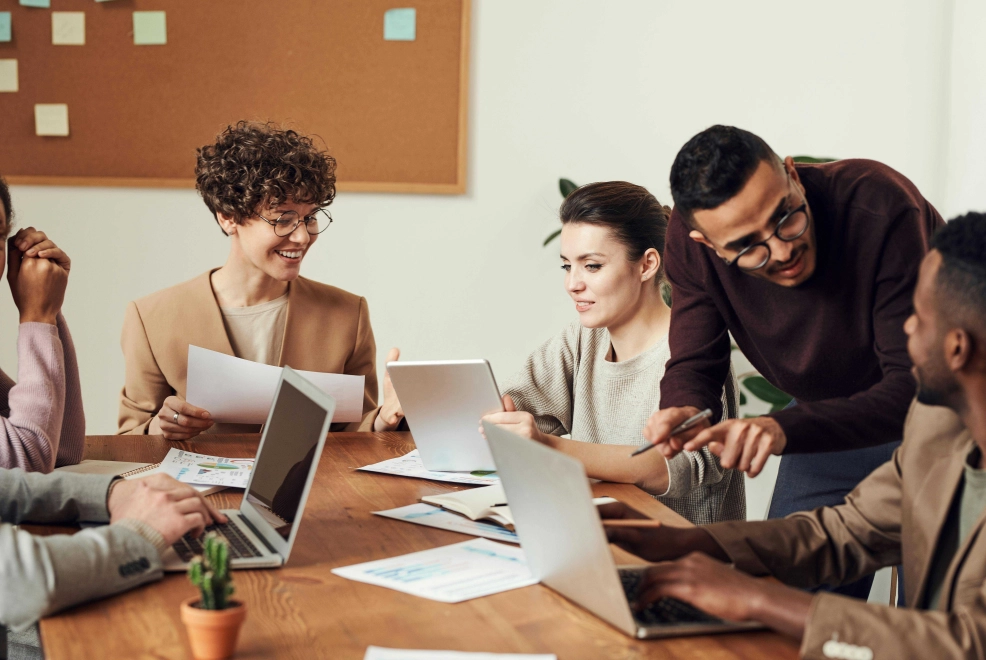 Business professionals discussing salary threshold changes in the Netherlands